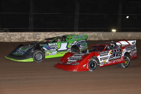 Tyler Erb (1) battles Bobby Pierce (32) in Wednesday's feature. (mikerueferphotos.photoreflect.com)