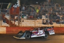 Brandon Overton of Evans, Ga., takes the checkered flag to win Friday&#039;s Jerry Goodwin Tribute Race to Beat Cancer at Talladega Short Track in Eastaboga, Ala. He earned $3,800 in the 38-lap feature. (Zackary Washington/Simple Moments Photography)