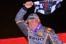 Dale McDowell waves the checkers in victory lane Oct. 6 at Tri-County Racetrack in Brasstown, N.C., after his first career Castrol FloRacing Night in America victory. (joshjamesartwork.com)