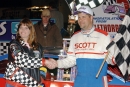 Track promoter Arlene Pittman (left) congratulates Earl Pearson Jr. (right) after the Jacksonville, Fla., driver won the first night of a weekend doubleheader at Oglethorpe Speedway Park near Savannah, Ga., on Jan. 30, 2004. Pearson earned $5,000 for winning the Georgia Triple Crown Series opener. (Brian McLeod)