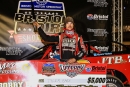 Tyler Bare poses with the check and sword after winning Saturday’s  $5,000 Bristol Dirt Showcase for the Steel Block Bandits Dirt Late Model  Challenge at dirt-covered Bristol (Tenn.) Motor Speedway. (ZSK  Photography)