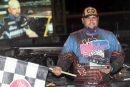 Ryan Gustin poses in victory lane after his $6,000 win in May 26&#039;s World of Outlaws Case Late Model Series-sanctioned Battle at the Border preliminary feature at Sharon Speedway in Hartford, Ohio. (Todd Battin)