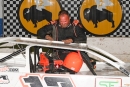 Chad Becker emerges from his car victorious June 2 in the Repairable Vehicles.com Tri-State Series at Brown County Speedway in Aberdeen, S.D. (jamielainephoto.com)
