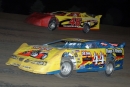 Eric Mass (44) battles Blaine Doppler (46) for the lead at Dacotah Speedway in Mandan, N.D., in a NAPA-MDA Series event on June 9, 2006. Mass, of Rapid City, S.D., went on to win the race, while Doppler finished second. (J.R. Hughes)