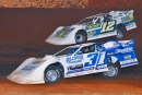 Ashton Winger (12) overtakes Tyler Millwood (31) on Sept. 29 en route to a Hunt the Front Super Dirt Series victory at Talladega Short Track in Eastaboga, Ala. (Zackary Washington/Simple Moments Photography)