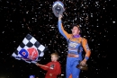 Nick Hoffman and son, Maddox, celebrate a $12,000 Federated Auto Parts DIRTcar Nationals victory at Volusia Speedway Park after leading the final lap of Thursday&#039;s fourth round. (joshjamesartwork.com)