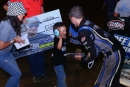 After capturing $4,249 in Clarksville (Tenn.) Speedway's J.R. Knight Memorial on May 18, 602 Crate Late Model winner Cass Fowler gets a high-five from Knight's son Blake. (joshjamesartwork.com)