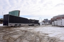 Race car haulers in downtown St. Louis head for The Dome at America's Center for the weekend's Kubota Gateway Dirt Nationals. (photosbyboyd.smugmug.com)