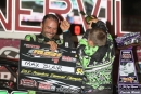 Winner Max Blair (center) gets douses after his $20,000 victory June 27 at Lernerville Speedway for his fourth Bill Emig Memorial victory on the RUSH Crate Late Model Series. (Clifford Dove)