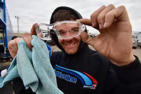 Joel Rogers wore scratched safety glasses on a windy night. (DirtonDirt)