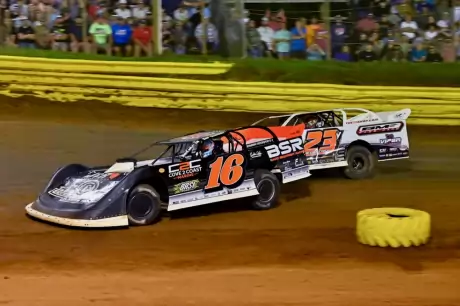 Sam Seawright (16) overtakes Cory Hedgecock (23v). (Zackary Washington)