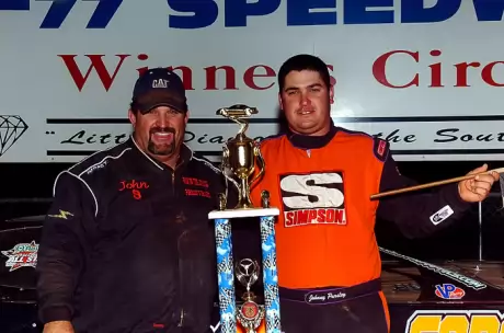 Runner-up John Pursley joins his winning son in victory lane. (George 