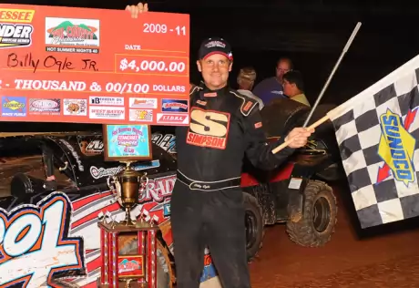 Billy Ogle Jr. picks up his earnings. (dt52photos.com)