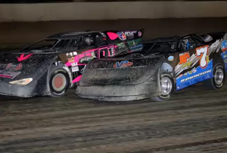 Winner Rusty Schlenk fights off Kent Robinson (7r). (Jim DenHamer)