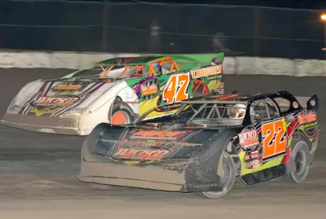 Tyler Ivey (47) goes around Brandon Cameron (22B). (ricksdarkroom.com)