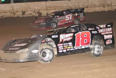 Winner Shannon Babb (18) takes third from Mark Faust (51). (Jim DenHamer)