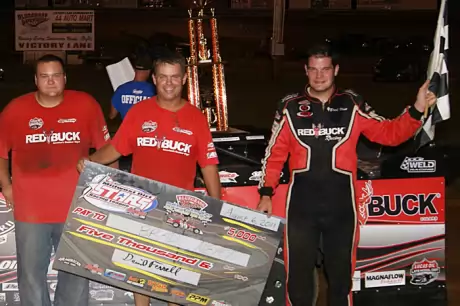 Brad Neat along with crew members Mark Hopper (left) and Whitney McQueary (center) visit victory lane. (Hilary Ballard)