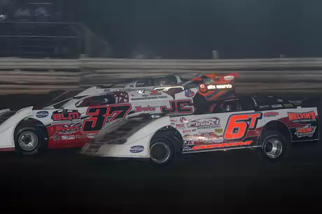 Jared Hawkins (37) grabs the lead after a three-wide battle. (Todd Battin)