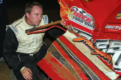 Luke Roffers checks out the damage to his car at Dublin Motor Speedway. (focusedonracing.com)