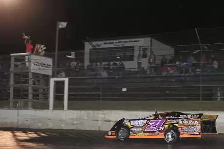 Billy Moyer Jr. takes the checkers at Topeka for the second straight night. (fasttrackphotos.net)