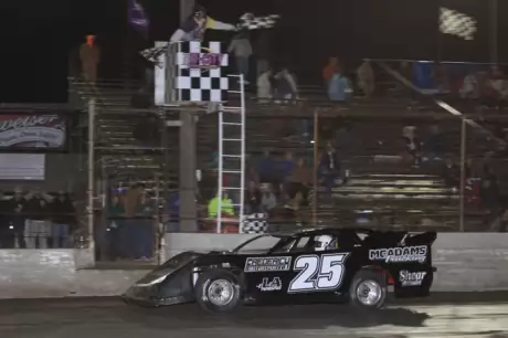 Steve Lance Jr. takes the checkers at Tri-City. (stlracingphotos.com)