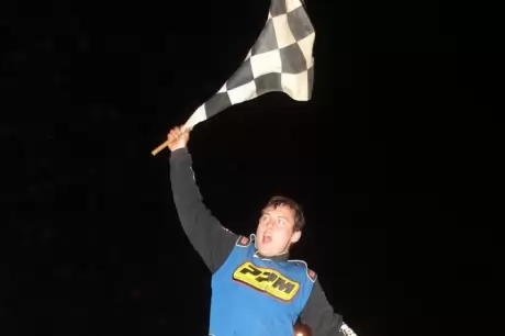 Chris Wilson celebrates his $4,000 victory. (Chad Wells)