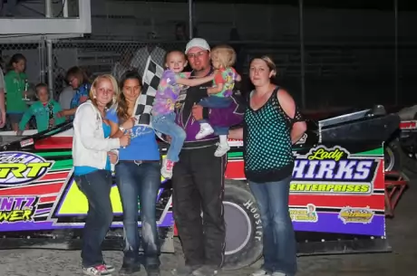Jason Schierkolk and supporters celebrate in victory lane at Casper Speedway. (andrewtownephotography.com)