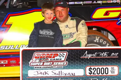 Jack Sullivan celebrates with son Jace after his Comp Cams Series victory. (Woody Hampton)