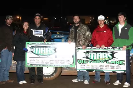 Raymond Merrill and his crew enjoy victory lane. (Ron Mitchell)
