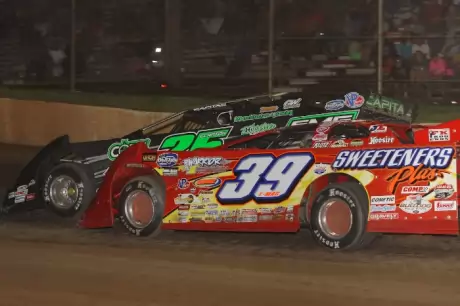 Tim McCreadie (39) and Shane Clanton (25) battle at I-30. (Woody Hampton)