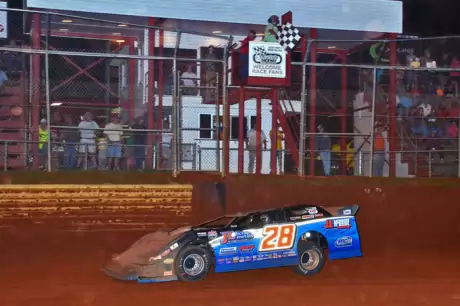 Dennis Erb Jr. takes the checkers. (Troy Bregy)