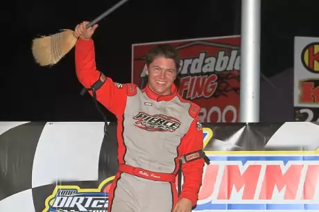 Bobby Pierce shows off the broom after completing a sweep at Tri-City. stlracingphotos.com)