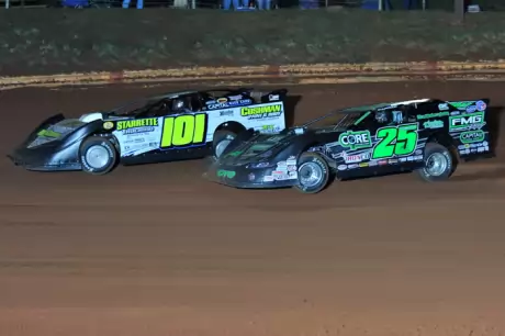 Casey Roberts (101) turns back Shane Clanton on his way to victory. (binghamfreelance.com)