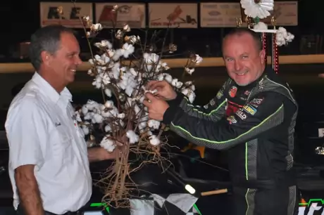 Jimmy Owens picks the cotton in victory lane. (DirtonDirt.com)