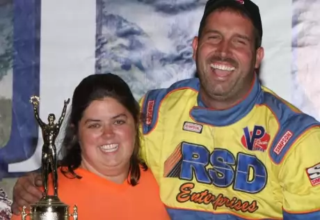 Clanton celebrates with his wife, Jennifer. (mikerueferphotos.photoreflect.com)