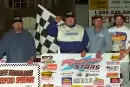 Jackie Boggs of Grayson, Ky., celebrates his flag-to-flag win in the Renegade STARS-sanctioned Spring Thaw 40 at Bedford (Pa.) Speedway on April 27, 2001. He earned $5,000 for his second STARS victory of the season. (rickschwalliephotos.com)