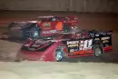 Rob Blair (Won11) works under Greg Johnson (4) on his way to an Independent Racing Series victory at Twin Cities Raceway Park in North Vernon, Ind., in May 2007. (DirtonDirt.com)
